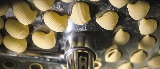 Image of pasta being extruded